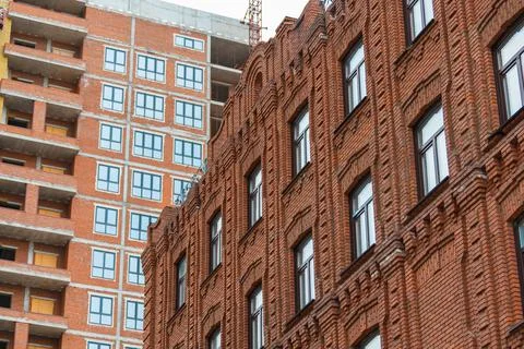 An old building against a modern background Stock Photos