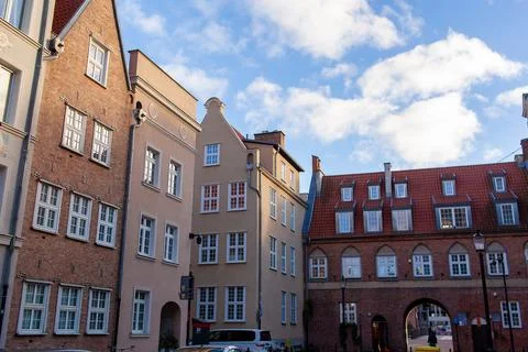 Old building with arches and windows in a city square during daylight Stock Photos