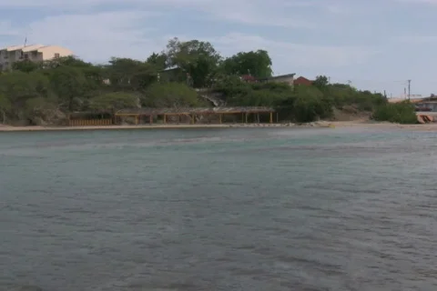Old building on a beach NTSC Stock Footage 264283