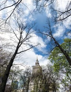 Old building behind the trees Photos