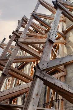 An old building is being supported because it is in danger of collapsing. Photos
