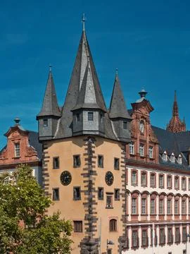 Old building with a clock and a joyride with more tips 스톡 사진
