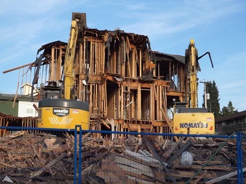 Old building demolition. Excavator working at the construction site. Stock Footage 114545938