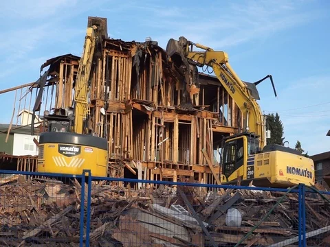 Old building demolition. Excavator working at the construction site. Stock Footage 114545949