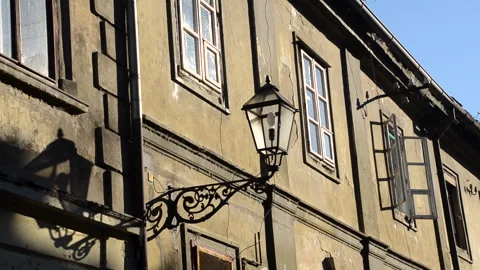 Old building facade in city.  Old town architecture. Street lamp Stock Footage 143094447