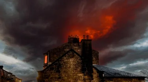Old Building In Front Of A Burning Sky. Stock Photos