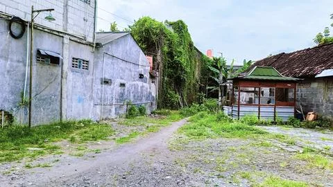 An old building with a grey wall Stock Photos