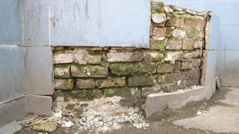 Old building interior some of tiles in the are falling off from the wall Stock Footage 155554856