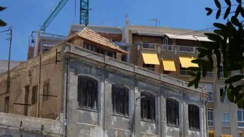Old building at reconstruction with a crane 動画素材 314936372