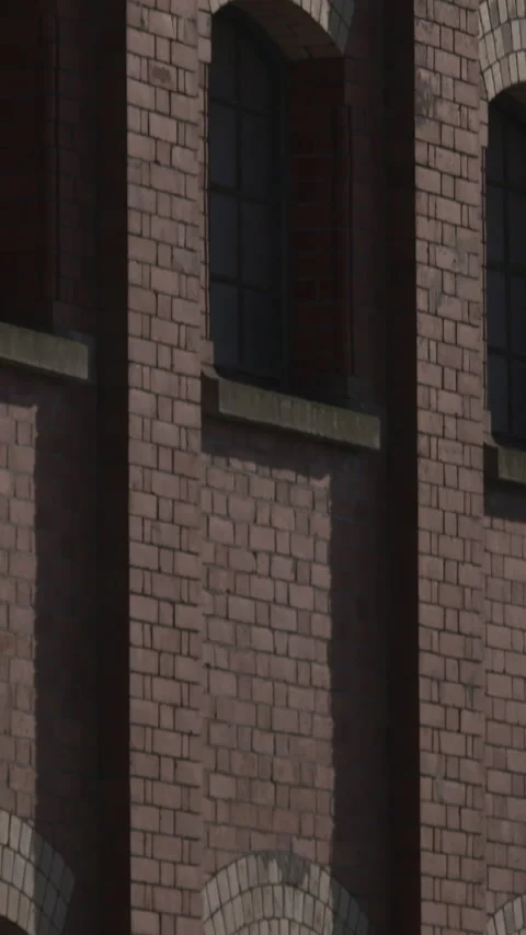 Old building red brick tall windows industrial derelict texture Stock Footage 341772074