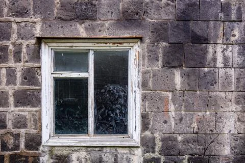 Old building wall with broken glass window Stock Photos