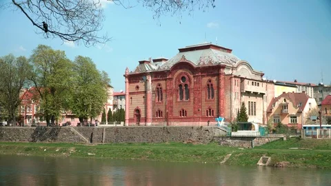 Old building on the waterfront. Clear spring day. In the background there are Stock Footage 106869499