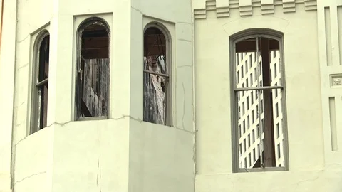 Old Building with windows and white painted walls Stock Footage 84508527