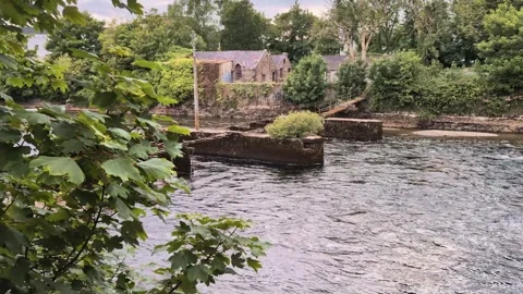 Old buildings and architecture by the Corrib river at Galway city Stock Footage 277323391