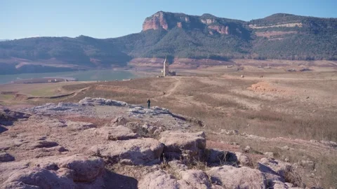 Old buildings emerging from empty swamp due textreme dryness in Spain. Stock Footage 265305624