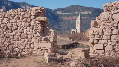 Old buildings emerging from empty swamp due textreme dryness in Spain. Stock Footage 265305721