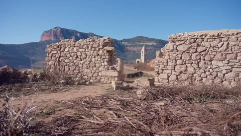Old buildings emerging from empty swamp due textreme dryness in Spain. Stock Footage 265305806