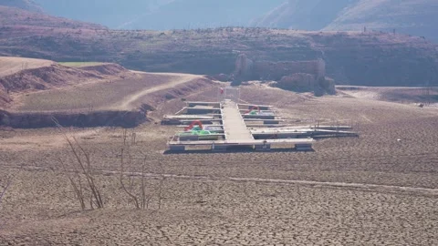 Old buildings emerging from empty swamp due textreme dryness in Spain. Stock Footage 265305866