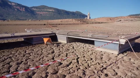 Old buildings emerging from empty swamp due textreme dryness in Spain. Stock Footage 265306059