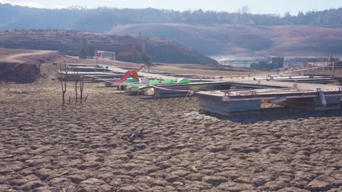 Old buildings emerging from empty swamp due textreme dryness in Spain. Stock Footage 265306073