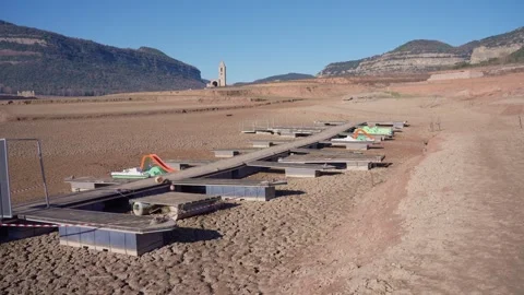 Old buildings emerging from empty swamp due textreme dryness in Spain. Stock Footage 265306361