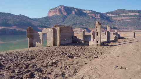 Old buildings emerging from empty swamp due textreme dryness in Spain. Stock Footage 265306411