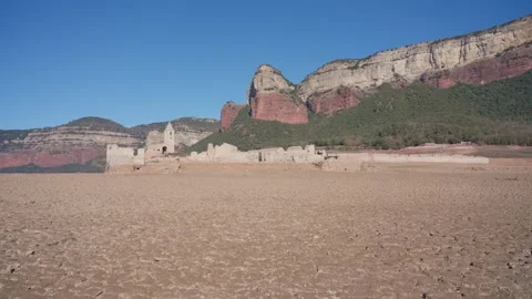 Old buildings emerging from empty swamp due textreme dryness in Spain. Stock Footage 265306691