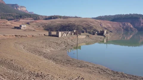 Old buildings emerging from empty swamp due textreme dryness in Spain. 스톡 동영상 265306808