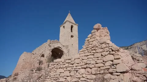Old buildings emerging from empty swamp due textreme dryness in Spain. Stock Footage 265307083
