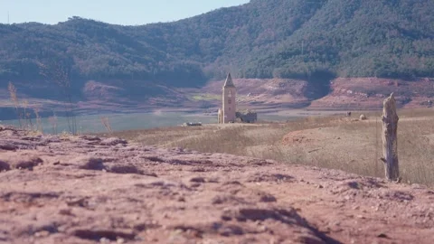 Old buildings emerging from empty swamp due textreme dryness in Spain. Stock Footage 265307200