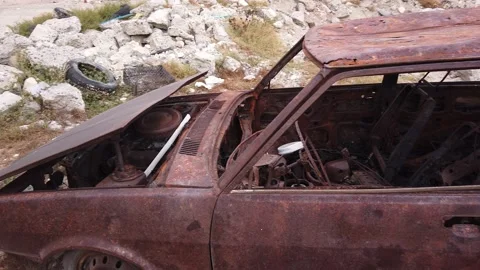 Old burned-out car. Rusty car frame. Close-up Stock Footage 138526066