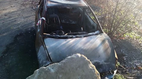 An old burned-out car. Rusty car frame. Stock Footage 143887329