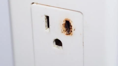Old Burnt Electric Fire Hazard Socket Household Macro Video. Stock Footage 331944747