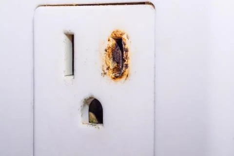 Old Burnt Electric Socket Household Macro. Stock Photos