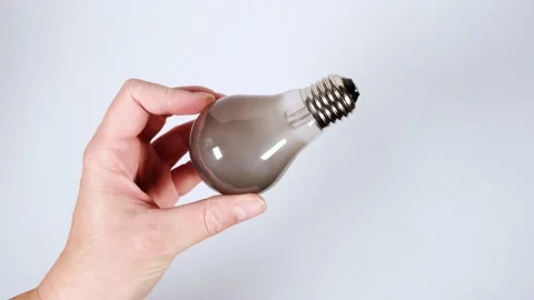 Old burnt light bulb with dark smoke inside 库存影片 159859886
