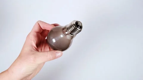Old burnt light bulb with dark smoke inside 库存影片 159859933