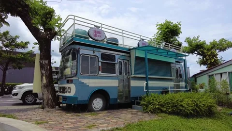 An old bus converted into a double-decker bar, bar bus Stock Footage 217500906