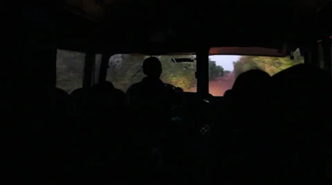Old bus on dirt and bumpy road from inside at sunrise Stock Footage 33334916