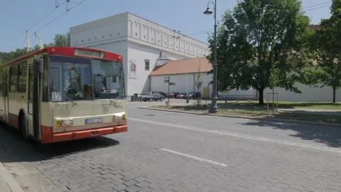 An old bus passes by in Vilnius Stock Footage 259839703
