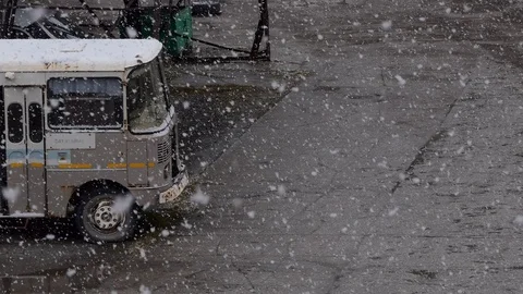 An old bus stands during a snowfall. Video stock 118188662