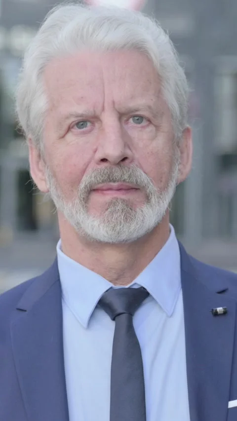 Old Businessman Looking at Camera while Standing Outdoor, Vertical Video Vídeos de archivo 339671406
