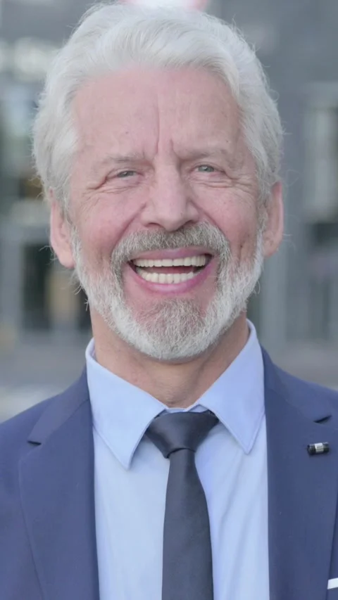 Old Businessman Smiling at Camera while Standing Outdoor, Vertical Video Vídeo Stock 339671326