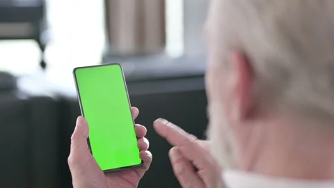 Old Businessman using Smartphone with Chrome Key Screen Stock Footage 132803653
