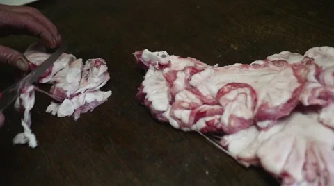 Old butcher cutting meat fat in slow motion Stock Footage 44292614