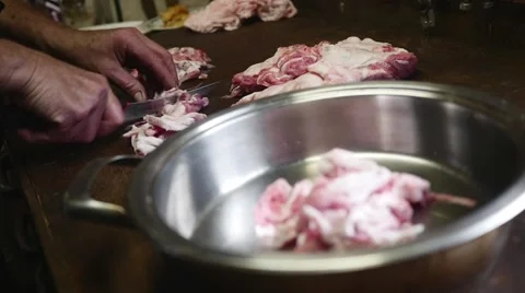 Old butcher cutting meat fat in slow motion Stock-Footage 44293737