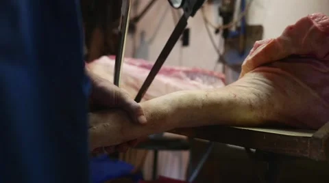Old butcher cutting meat with saw in slow motion Video stock 44288099