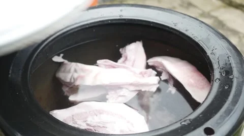 Old butcher opening pot with meat in slow motion Stock Footage 44290374