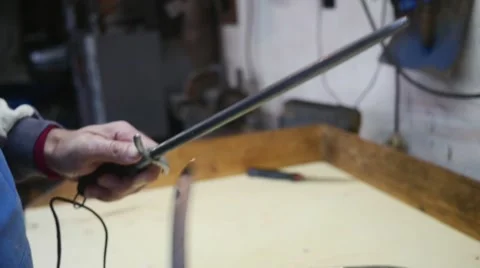 Old butcher sharpening his knife in slow motion Stock Footage 44291764