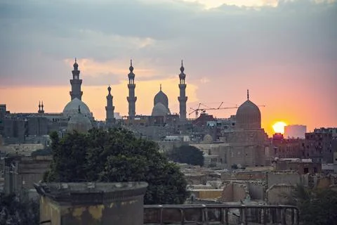 Old Cairo skyline at sunset, view of old and Coptic Cairo from the bridge, Egypt Stock Photos