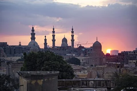 Old Cairo skyline at sunset, view of old and Coptic Cairo from the bridge, Egypt Stock Photos